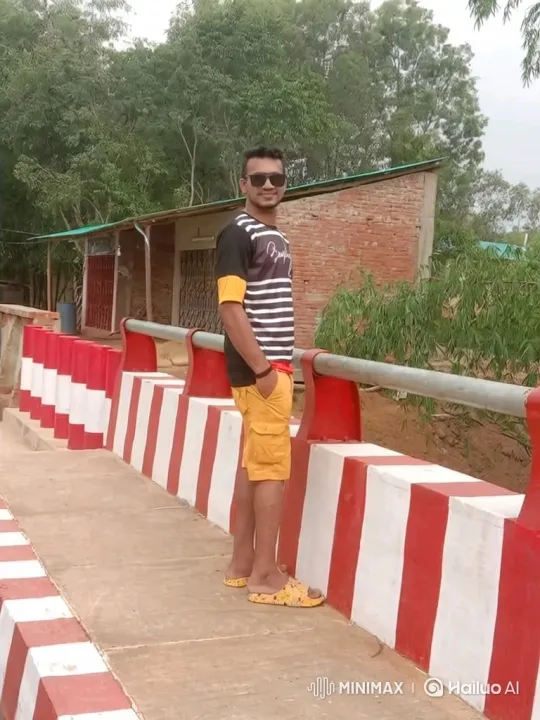 Young Man on Bridge with Gentle Breeze – AI Generated Video | Hailuo AI
