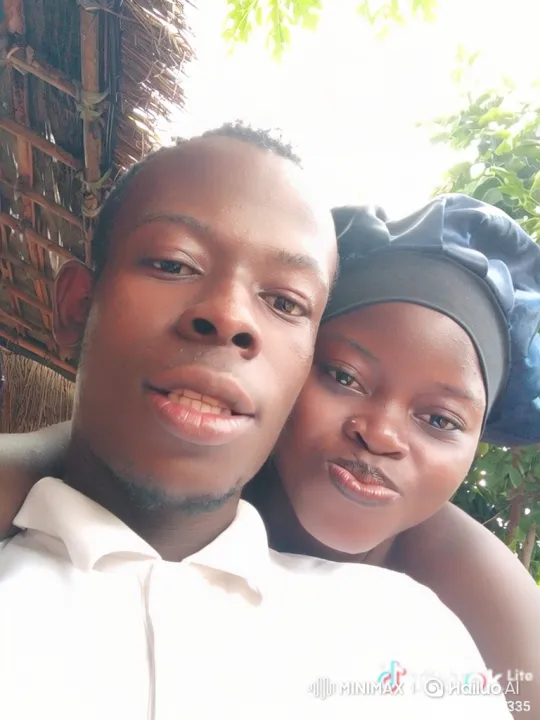 Young Black Couple's Joyful Moment Under a Thatched Roof – AI Generated Video | Hailuo AI
