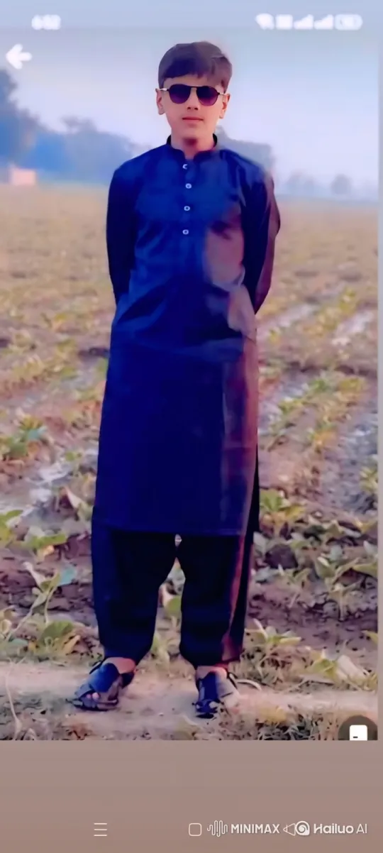 Young Boy in Field Observes Quietly as Camera Approaches – AI Generated Video | Hailuo AI