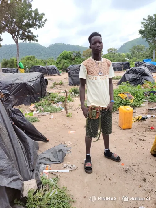 Young Man in Settlement Amidst Gentle Breeze – AI Generated Video | Hailuo AI