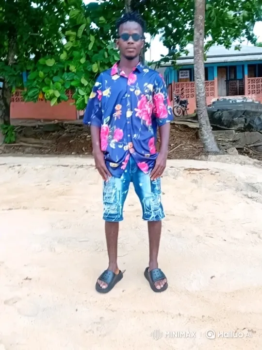 Young Man on Beach Observes Cars Passing By – AI Generated Video | Hailuo AI