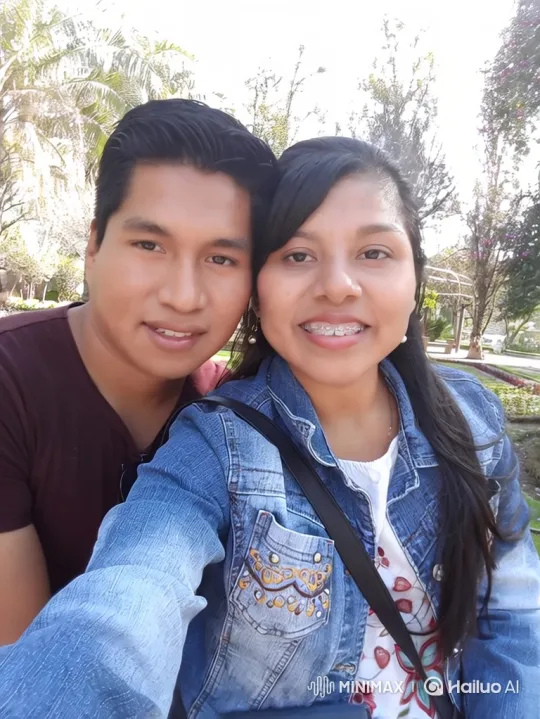 Happy Family Embraces in Sunlit Park – AI Generated Video | Hailuo AI