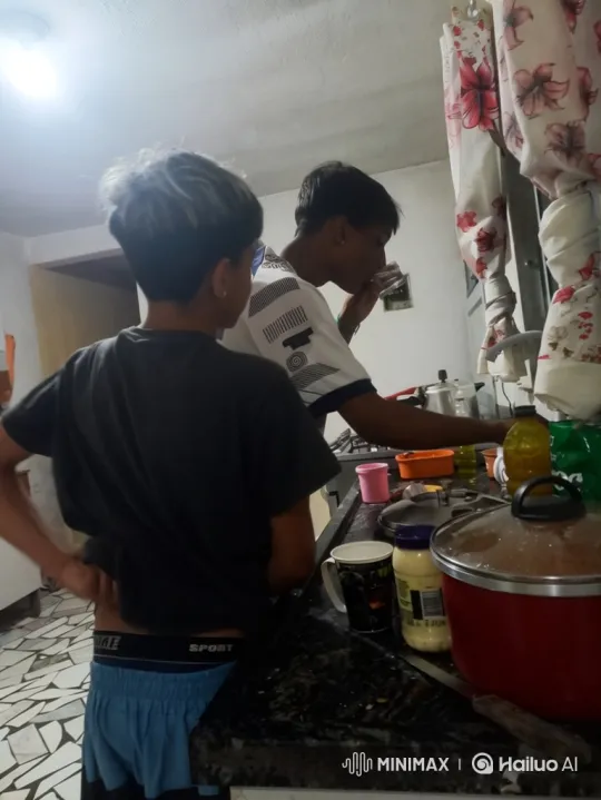 Young Men Share Intimate Moment in Kitchen – AI Generated Video | Hailuo AI
