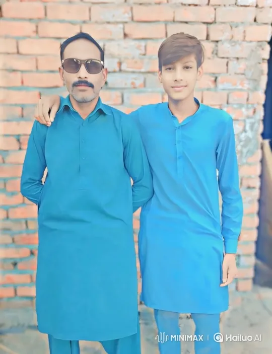 Father and Son Share Tender Moment in Front of Brick Wall – AI Generated Video | Hailuo AI