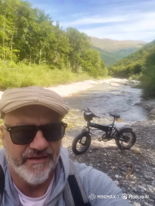 Man and His Bicycle in a Serene Valley Landscape – AI Generated Video | Hailuo AI
