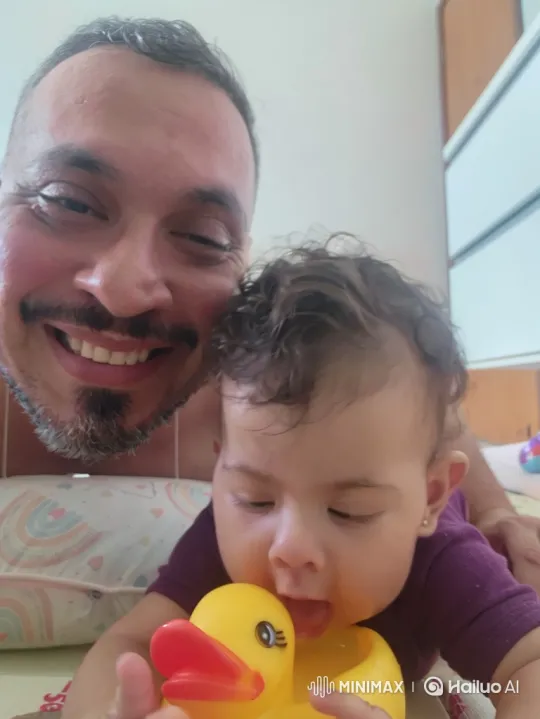 Father and Baby Enjoy Quiet Moment with Toy Duck – AI Generated Video | Hailuo AI