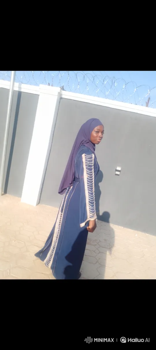 Woman in Embroidered Blue, Smiling, Outdoor Setting – AI Generated Video | Hailuo AI