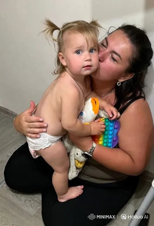 Affectionate Moment Between Mother and Toddler Ends with Joyful Laughter – AI Generated Video | Hailuo AI