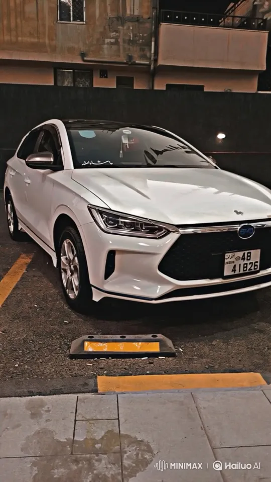 White Sedan's Hydraulic Descent in Urban Night Scene – AI Generated Video | Hailuo AI