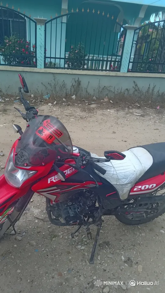 Red Motorcycle Rolls Out on Gravelly Path – AI Generated Video | Hailuo AI