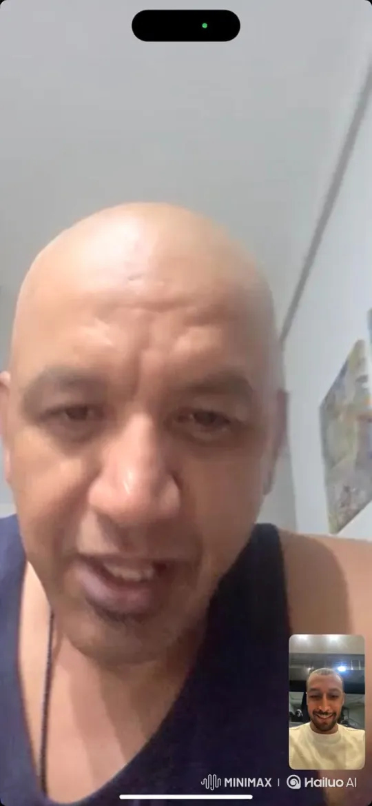 Bald Man Discussing with Bearded Man on Video Call – AI Generated Video | Hailuo AI