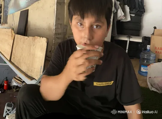 Young Boy Tense in Workshop as Officers Approach – AI Generated Video | Hailuo AI