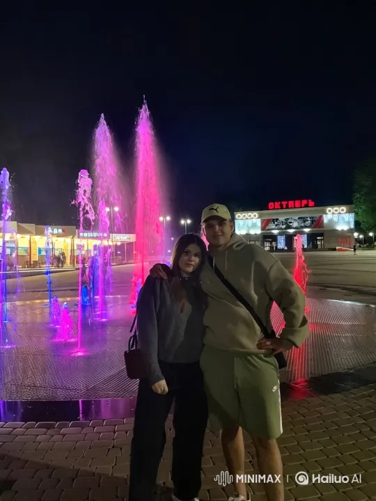 Family Embrace Captured on Night Plaza Video – AI Generated Video | Hailuo AI