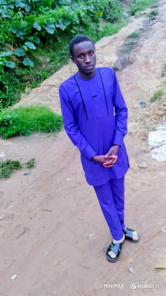 Young Man in Purple Stands Still as Camera Moves – AI Generated Video | Hailuo AI