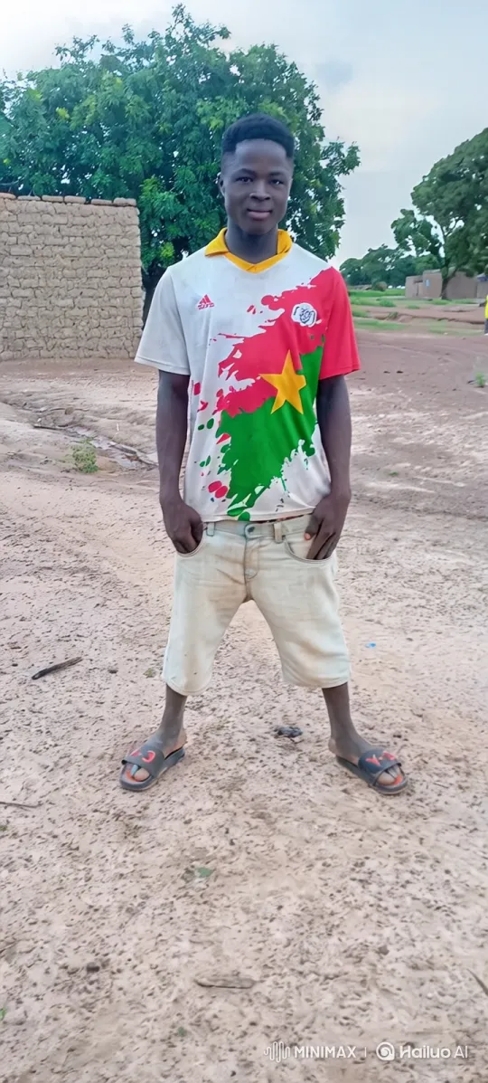Young Man Observes Cars Pass in Rural Village – AI Generated Video | Hailuo AI
