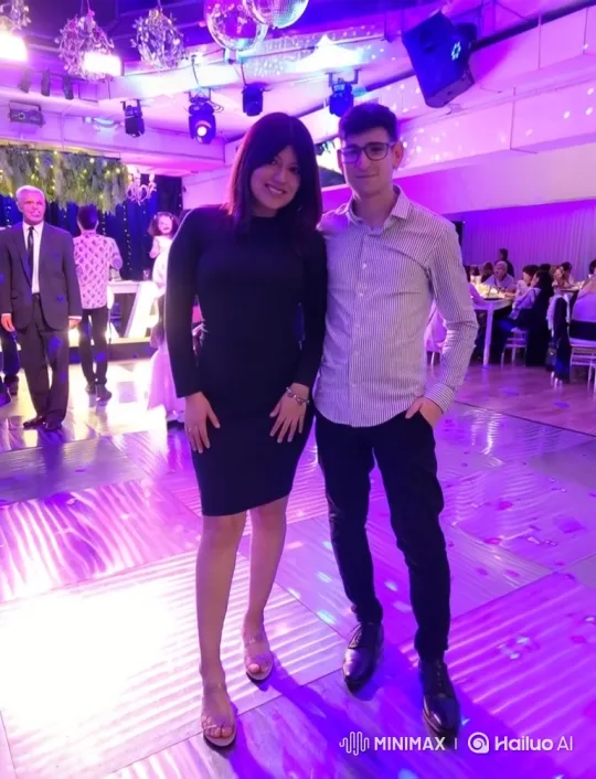 Family Embrace on Colorful Dance Floor – AI Generated Video | Hailuo AI