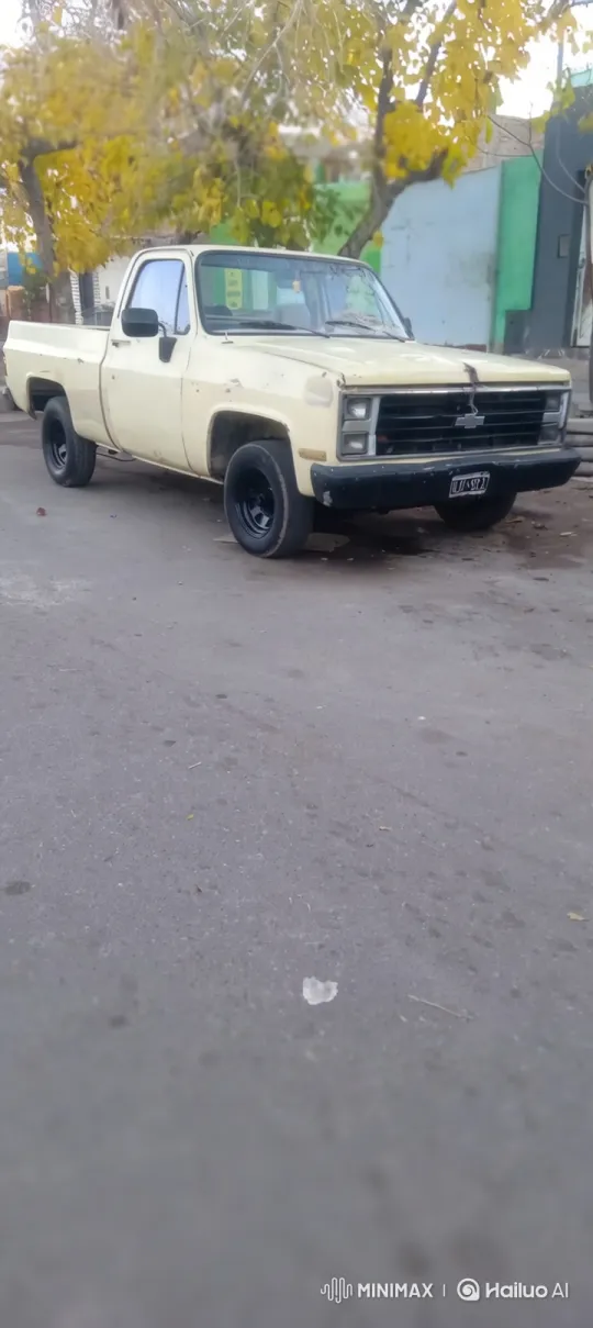 Vintage Truck Lowering on Urban Street with Autumn Tree – AI Generated Video | Hailuo AI
