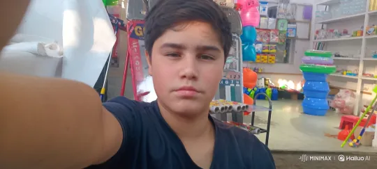 Young Boy Cycles Away from General Store – AI Generated Video | Hailuo AI
