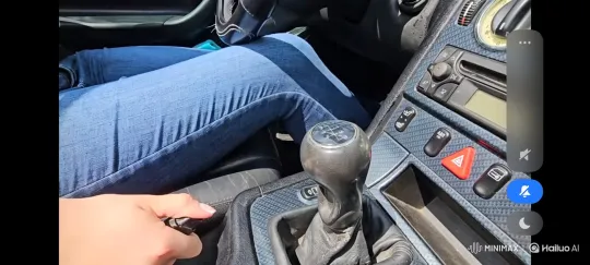 Close-up of a person licking a car's gear stick. – AI Generated Video | Hailuo AI