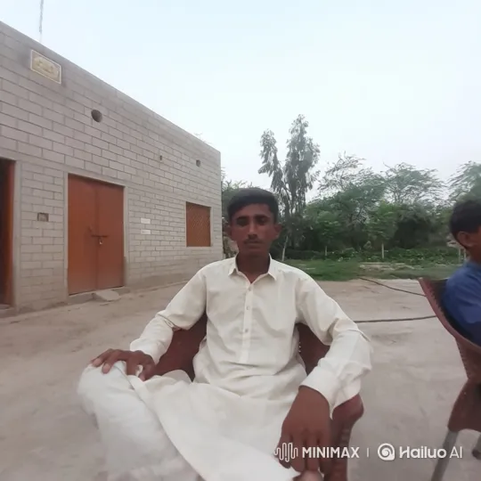 Young Man in Brown Chair Observes Quietly – AI Generated Video | Hailuo AI