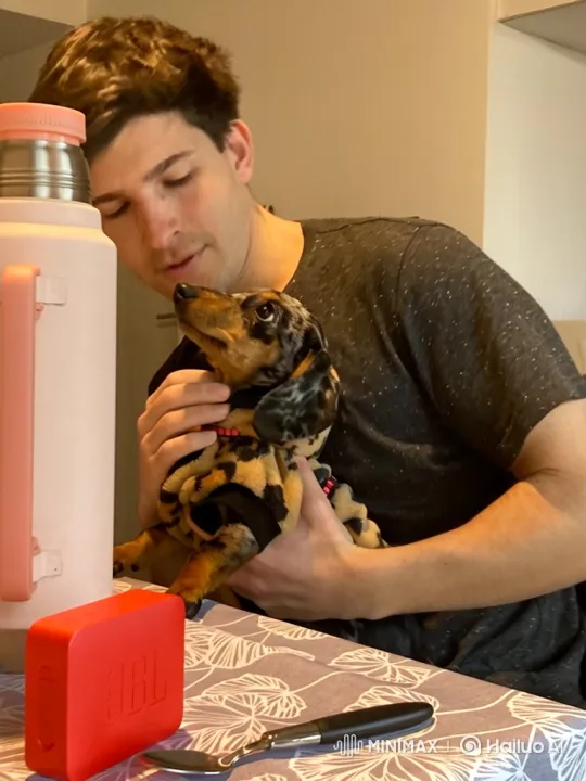 Young Man and Puppy Share Tender Moment – AI Generated Video | Hailuo AI