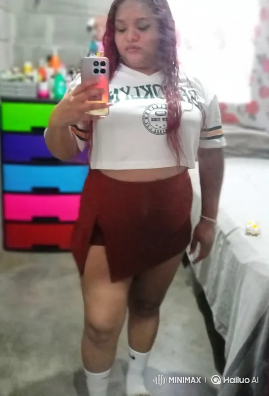 Young Woman Taking Mirror Selfie in Her Room – AI Generated Video | Hailuo AI