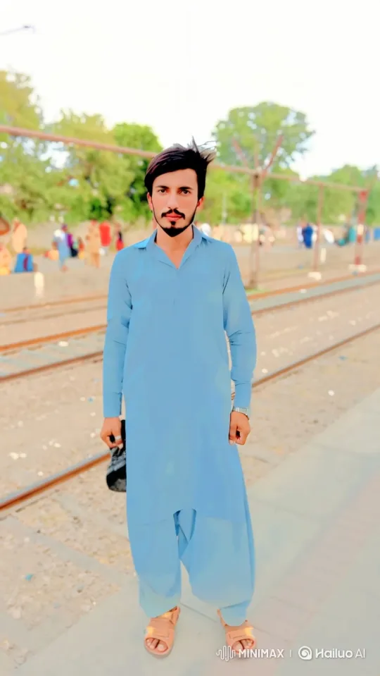 Young Man on Train Platform: Calm and Expectant – AI Generated Video | Hailuo AI