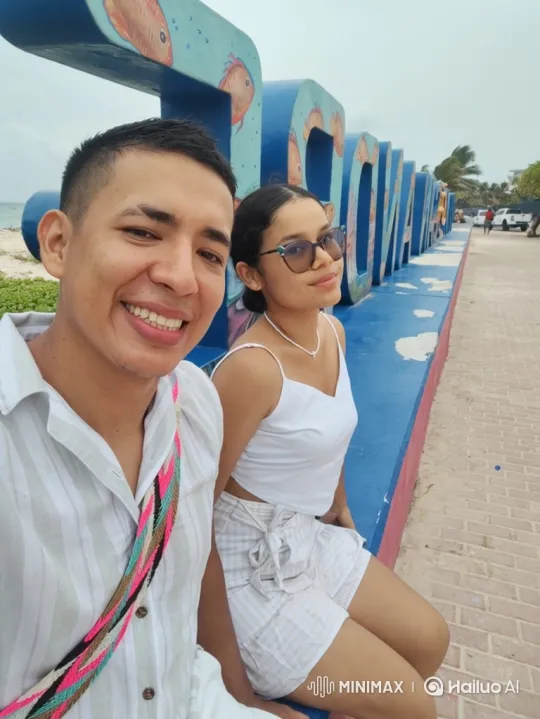 Family Embrace on a Sunny Tropical Boardwalk – AI Generated Video | Hailuo AI