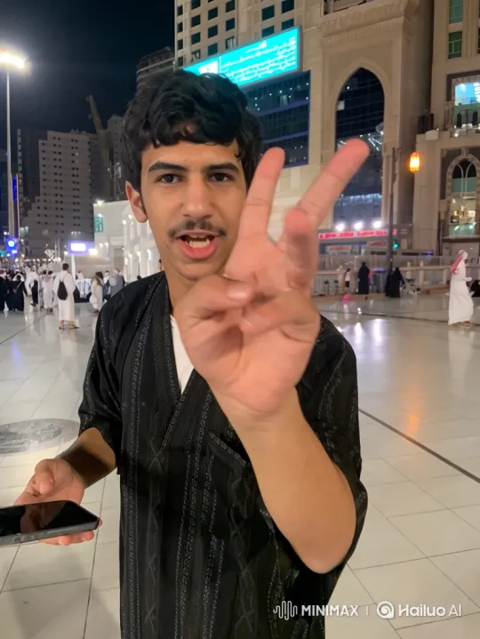 Young Man Smokes in Modern City Square – AI Generated Video | Hailuo AI