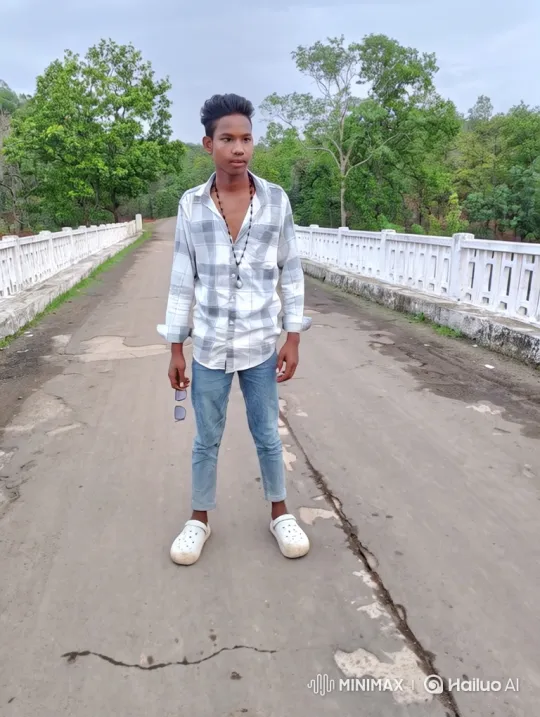 Young Man Walks Across Bridge in Tranquil Scenery – AI Generated Video | Hailuo AI