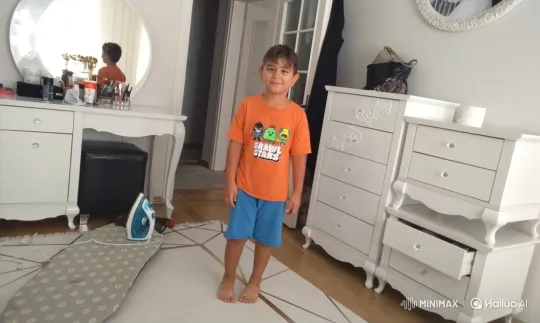 Young Boy Enjoys Chocolate Ice Cream in Bedroom – AI Generated Video | Hailuo AI