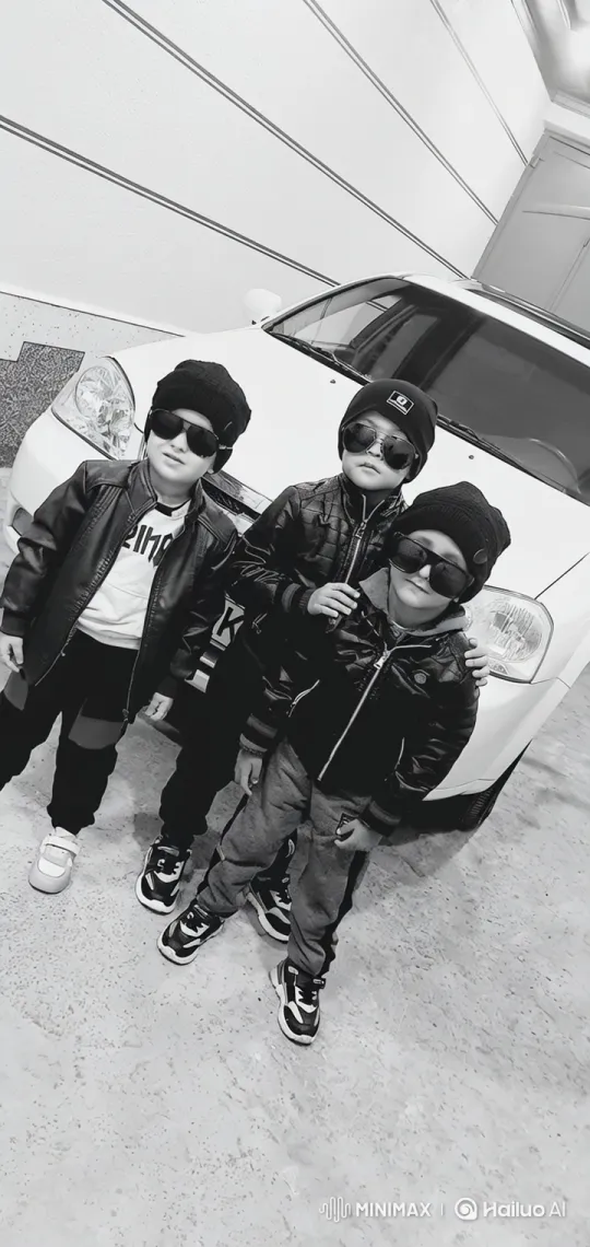 Boys in Black Stride Confidently Across Garage Scene – AI Generated Video | Hailuo AI
