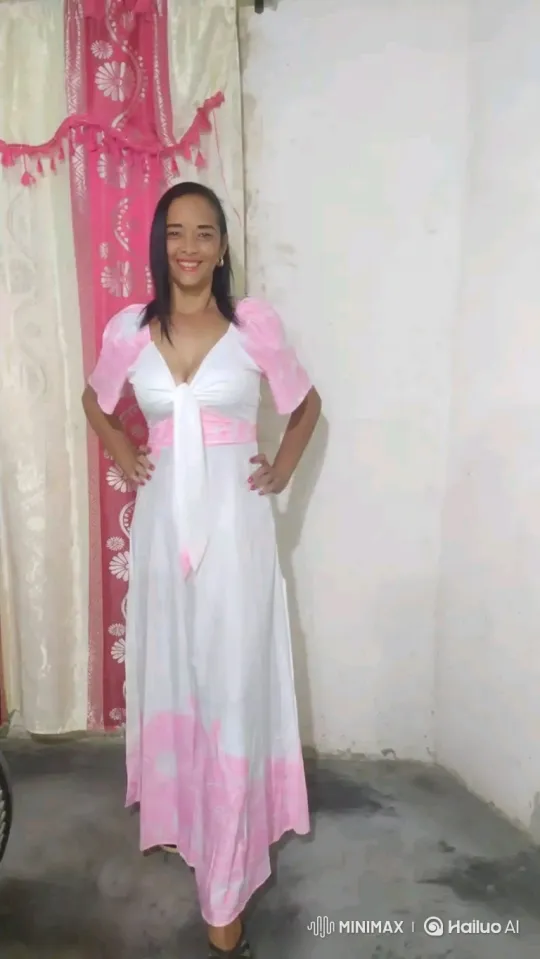 Woman Poses in White and Pink Dress with Warm Smile – AI Generated Video | Hailuo AI