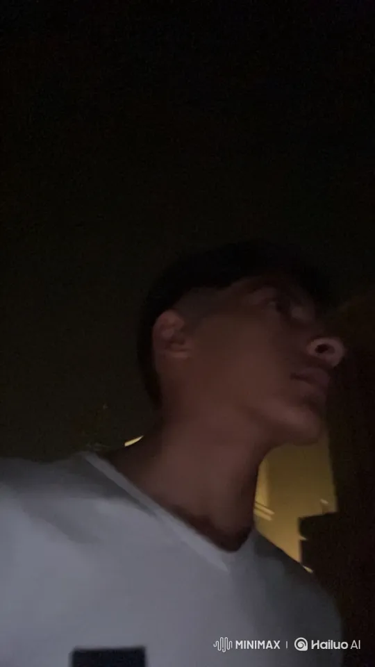 Young Man Reflects in Dim Light with Cigarette – AI Generated Video | Hailuo AI