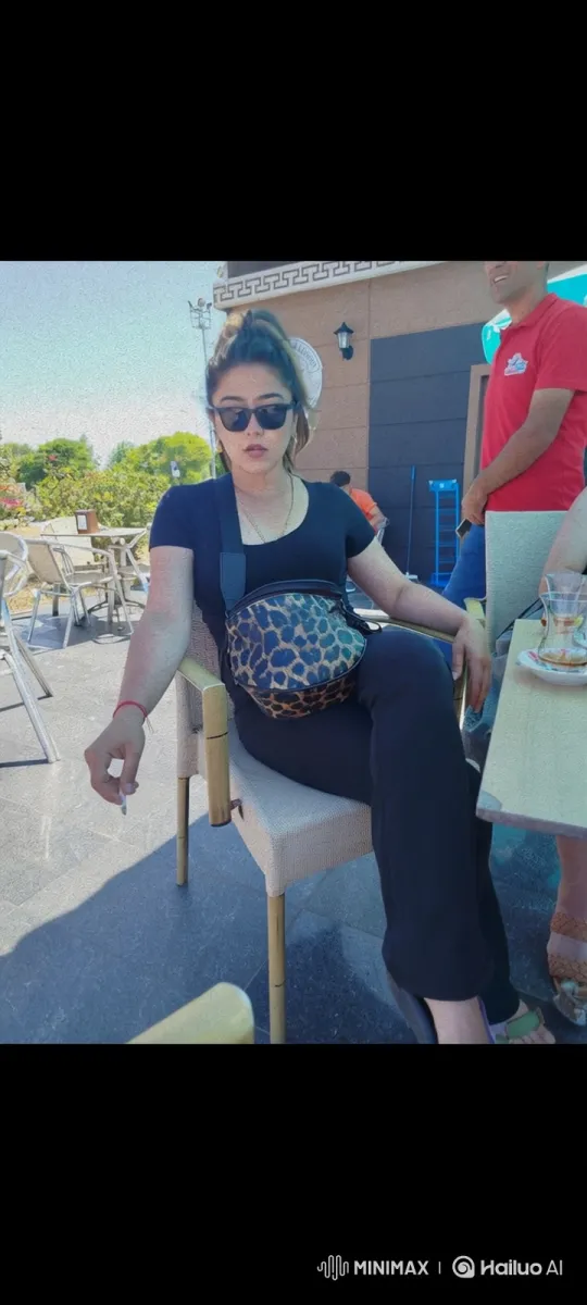 Young Woman Smoking on Patio - Sunlit Afternoon – AI Generated Video | Hailuo AI