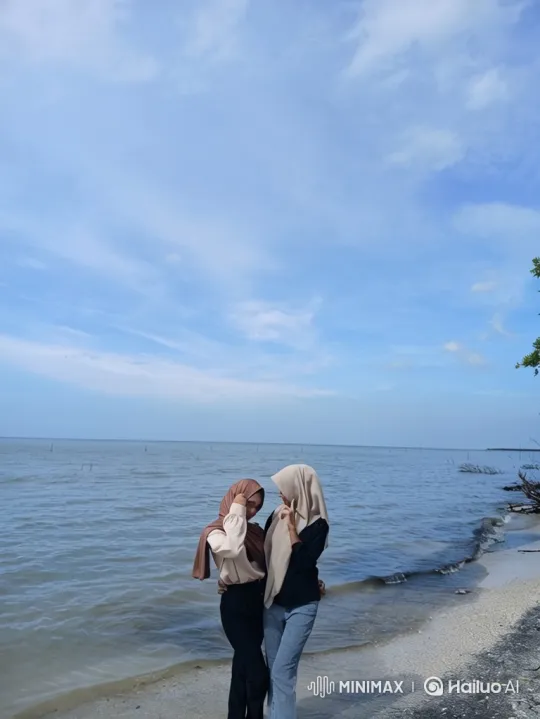 Cinematic Zoom Out from Two Women on a Shoreline – AI Generated Video | Hailuo AI