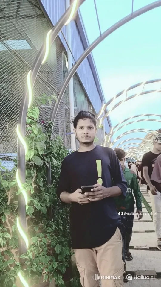Young Man on Walkway Using Smartphone – AI Generated Video | Hailuo AI