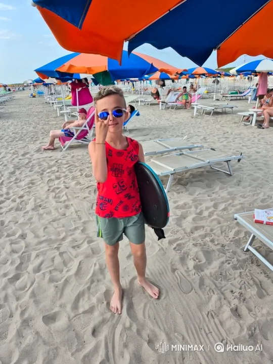 Boy Poses with Board on Vibrant Beach Scene – AI Generated Video | Hailuo AI