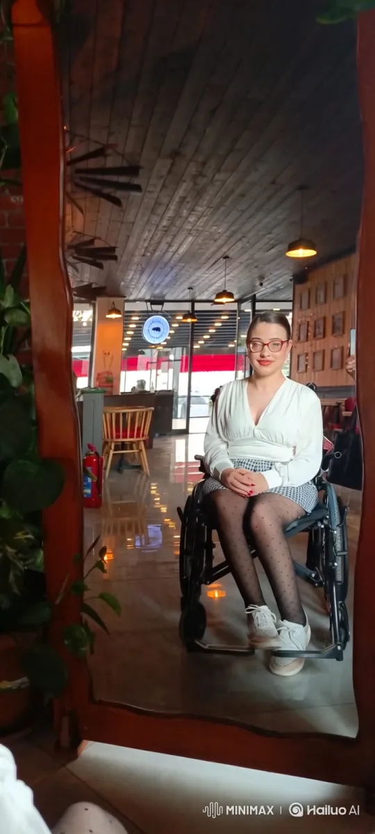 Young Woman in Wheelchair Enjoys a Dance in a Modern Cafe – AI Generated Video | Hailuo AI