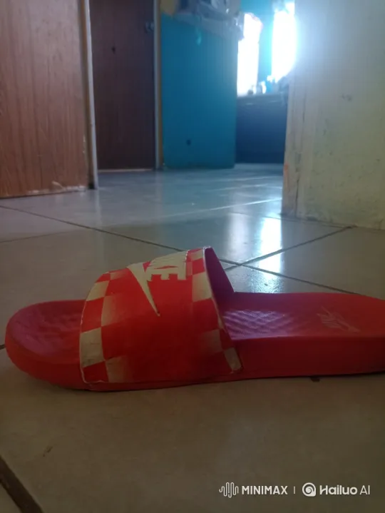 Red Sandal Escapes Down Hallway in Frenzied Dash – AI Generated Video | Hailuo AI