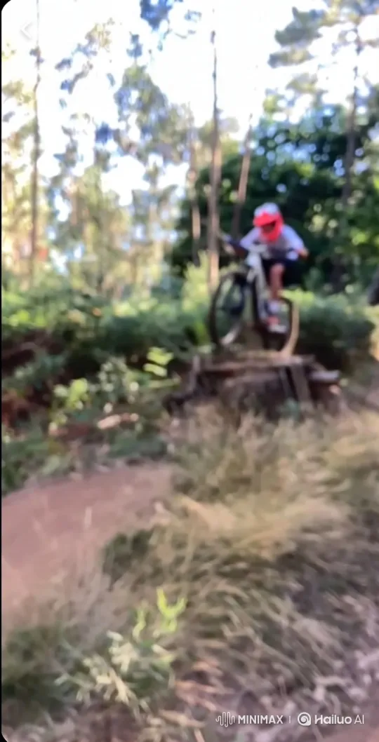 Mountain Biker Launches and Rides Through Forest Trail – AI Generated Video | Hailuo AI