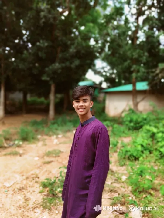 Young Man in Purple Tunic Smiles Outdoors – AI Generated Video | Hailuo AI