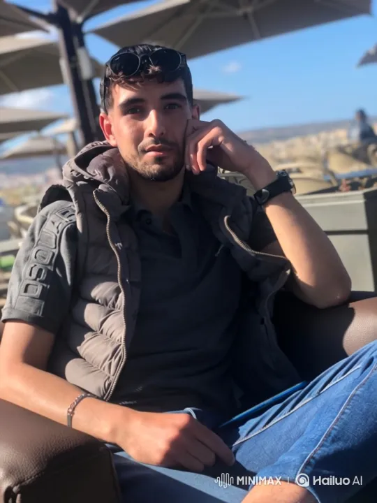 Young Man Reflects on Sunlit Terrace – AI Generated Video | Hailuo AI