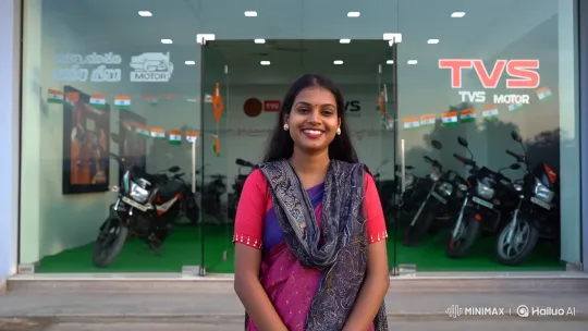 Young Tamil Woman Wishes Happy Independence Day at TVS Showroom – AI Generated Video | Hailuo AI