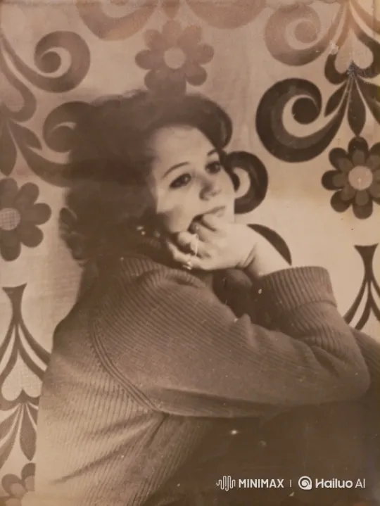 Contemplative Woman Smiles Softly in Sepia Portrait – AI Generated Video | Hailuo AI