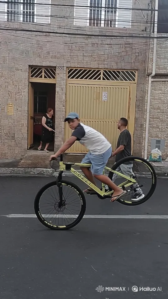 Young Boy Falls Off Bicycle While Performing Wheelie – AI Generated Video | Hailuo AI