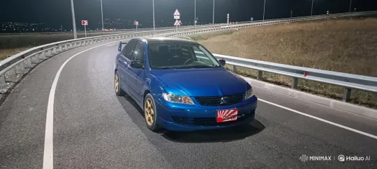 Isolated Blue Sedan on a Night Highway Ramp – AI Generated Video | Hailuo AI