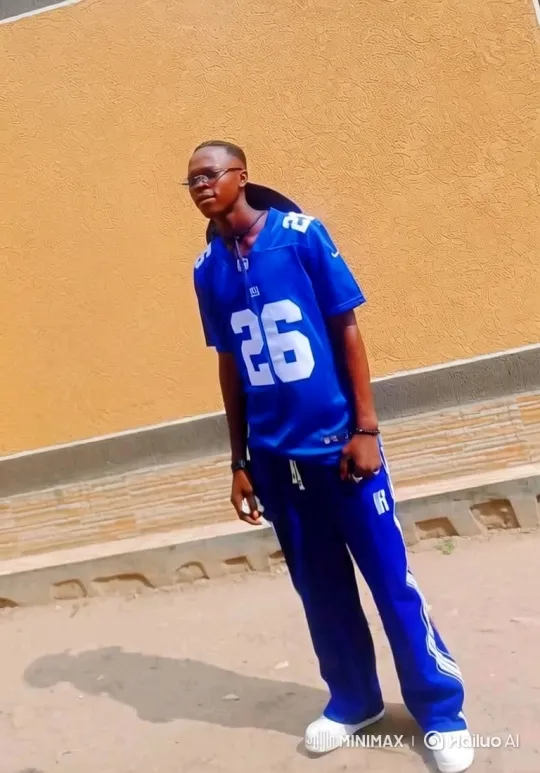 Young Black Man in Blue Athletic Outfit with Dynamic Camera Movement – AI Generated Video | Hailuo AI